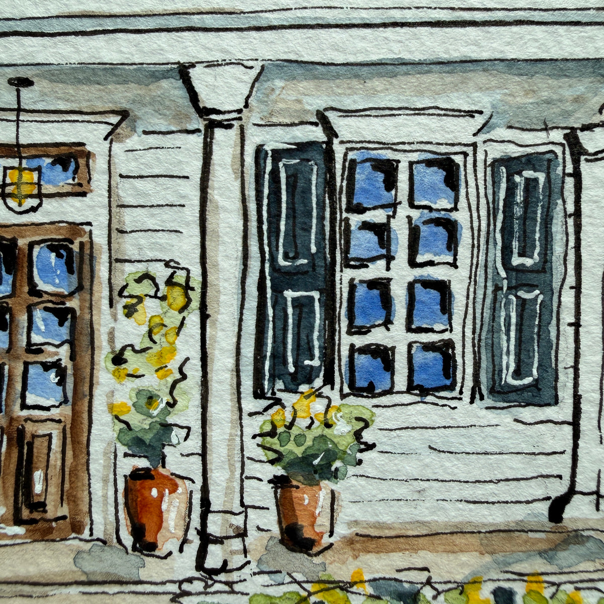 Detail of the white porch cottage watercolor showing the front door, porch column and potted yellow flowers
