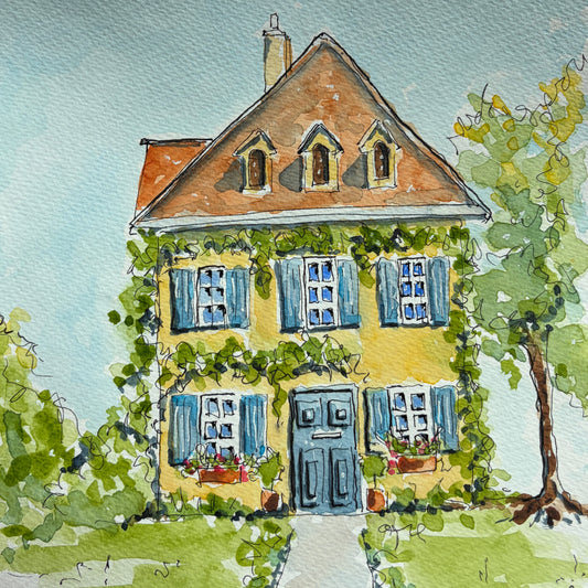 Watercolor and ink painting of a yellow house with blue shutters, climbing ivy, a blue front door and window boxes of red flowers