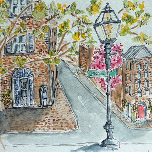 Watercolor and ink painting of a gas street lamp with a green Lynnie street sign, pink bougainvillea, brick buildings and an arched blue door